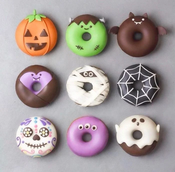 Assortment of spooky Halloween donuts decorated for the festive season.