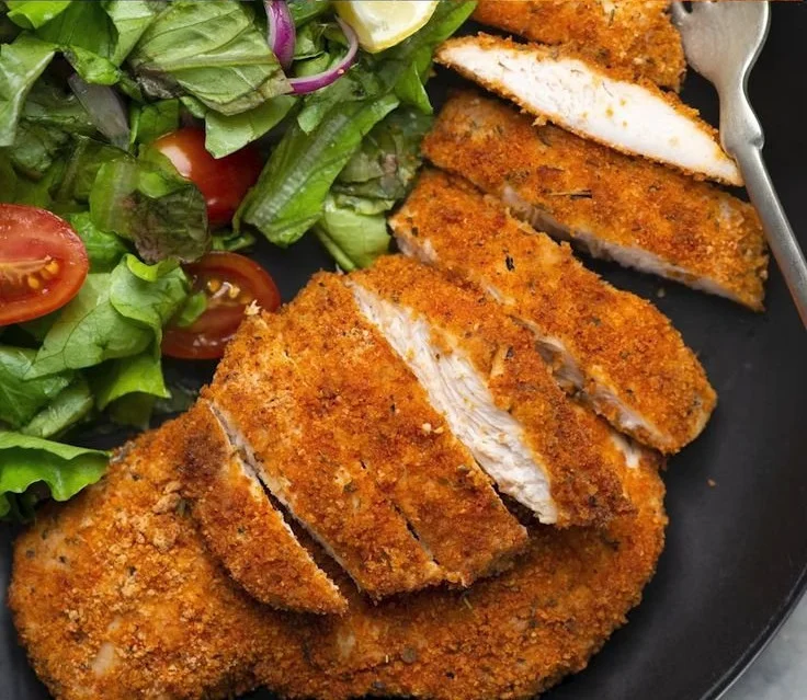 Juicy air fryer boneless chicken breast served with herbs and spices
