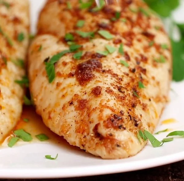 Succulent baked chicken breasts seasoned and ready to enjoy.