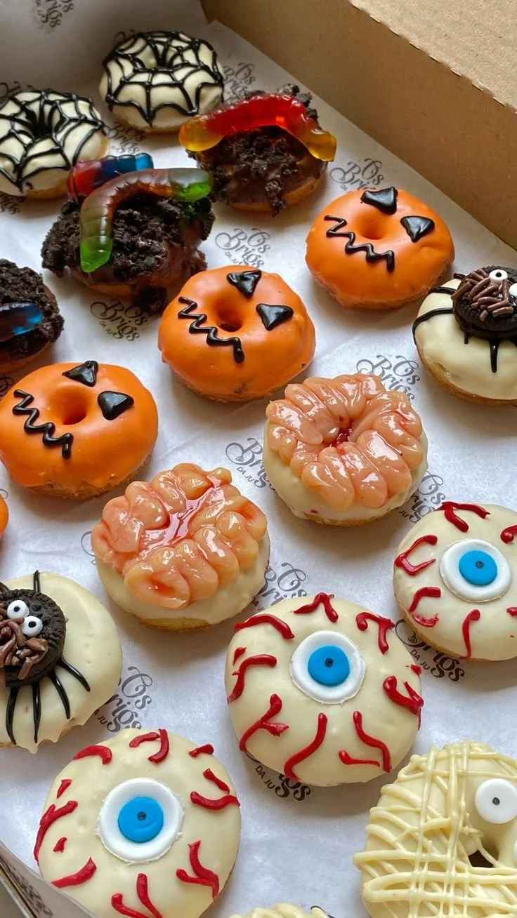 Delicious Halloween cake donuts with spooky decorations and festive colors