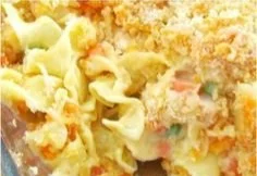 A hearty chicken noodle casserole served in a baking dish, topped with crispy breadcrumbs.