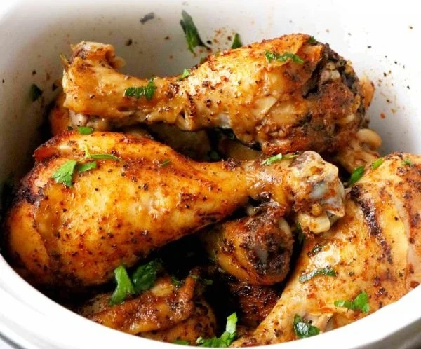 Delicious Crock Pot Chicken Legs served with herbs and spices