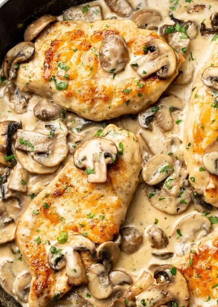 Easy chicken dinner with garlic and mushrooms on a plate