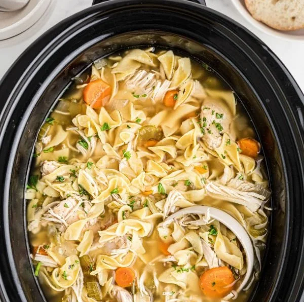 Bowl of Easy Slow Cooker Chicken Noodle Soup with noodles, chicken, and vegetables
