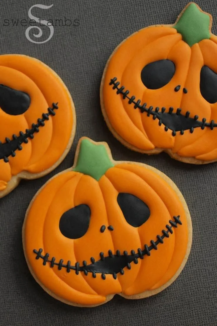 Halloween cookies decorated as Jack Skellington and Jack O'Lanterns.