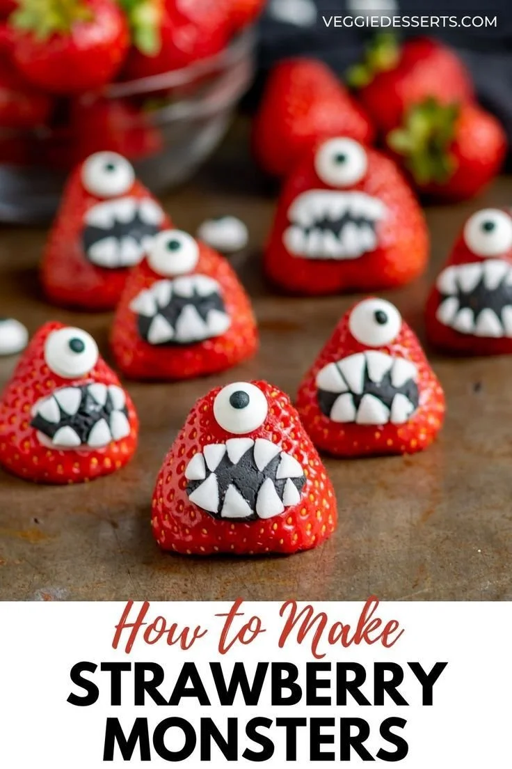 Halloween-themed strawberry monsters decorated for a spooky celebration