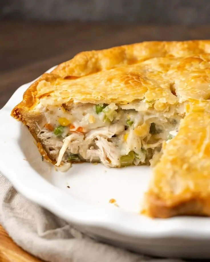 Delicious homemade chicken pot pie served with flaky crust and veggies