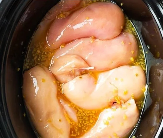 Delicious honey lime shredded chicken served in a bowl with fresh ingredients.