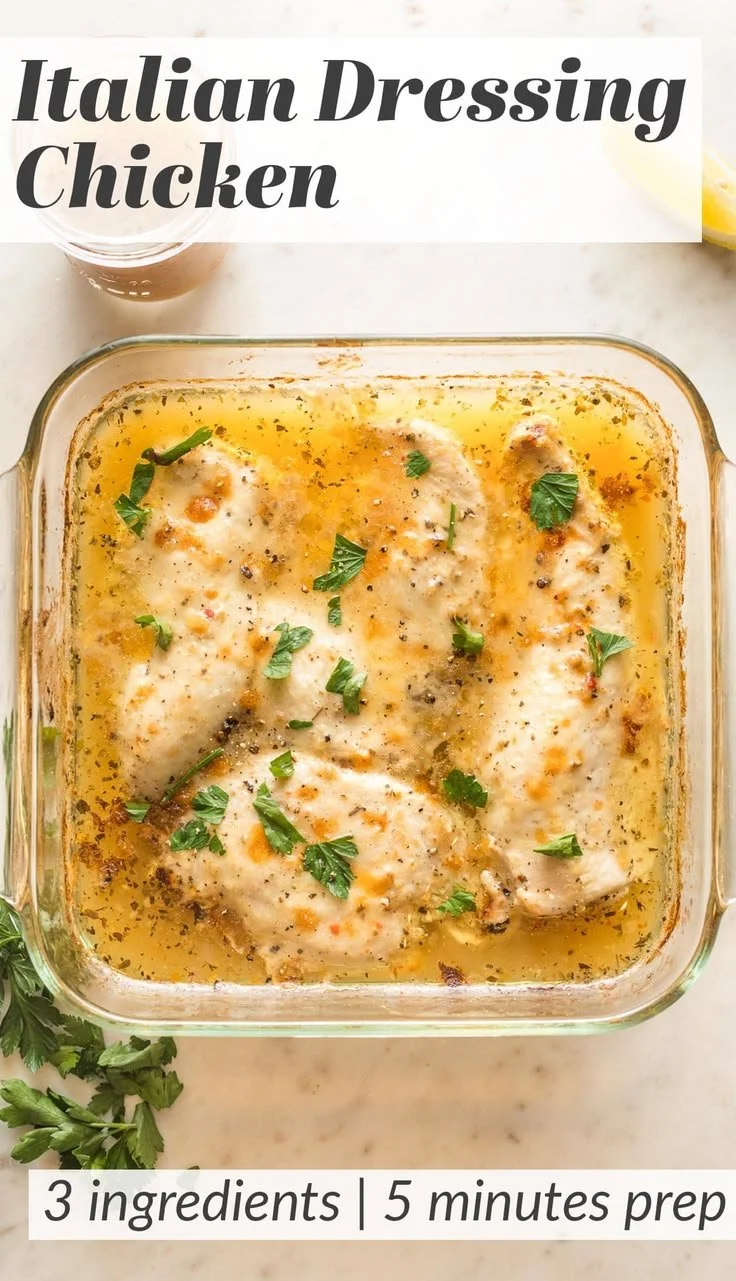 Baked Italian Dressing Chicken garnished with fresh herbs and vegetables.