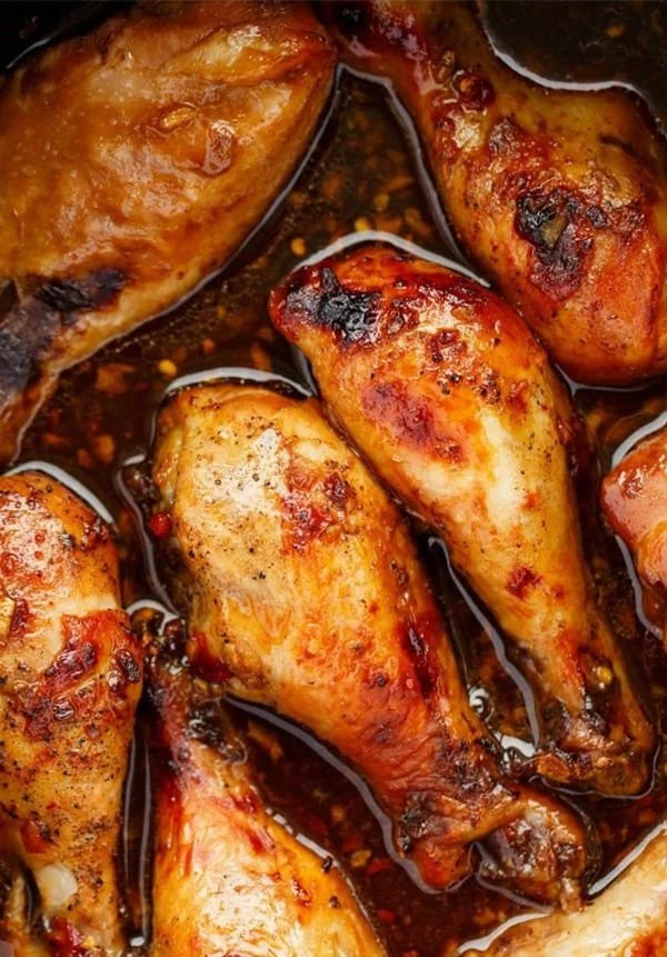 Slow Cooker Asian Chicken Drumsticks served with sesame seeds and green onions
