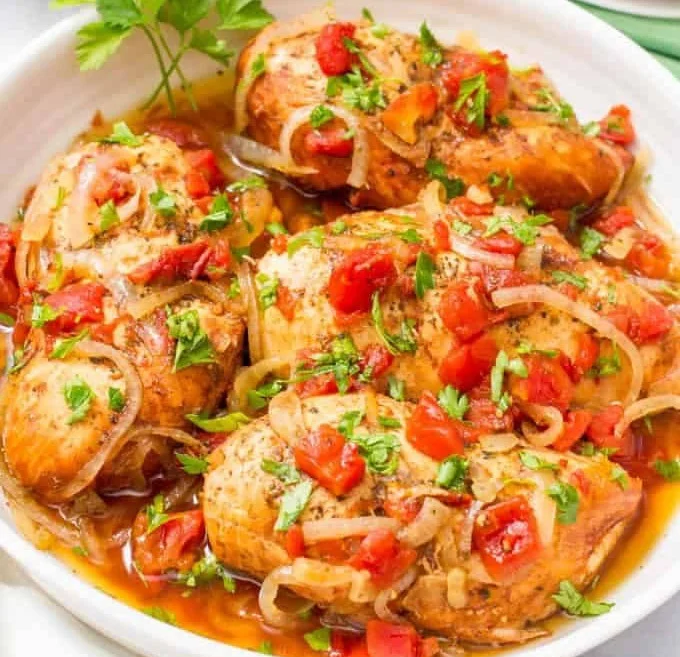 Slow cooker balsamic chicken dish with herbs and vegetables.