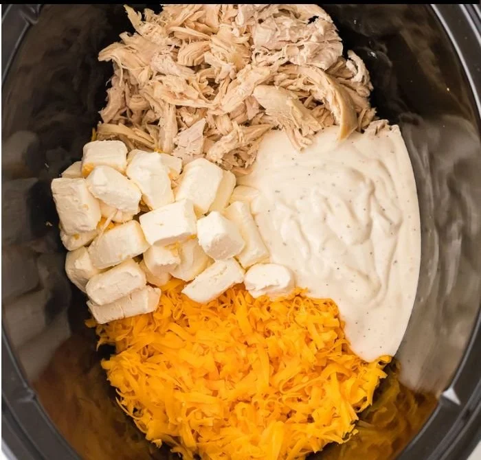 Creamy Slow Cooker Buffalo Chicken Dip served in a bowl with tortilla chips