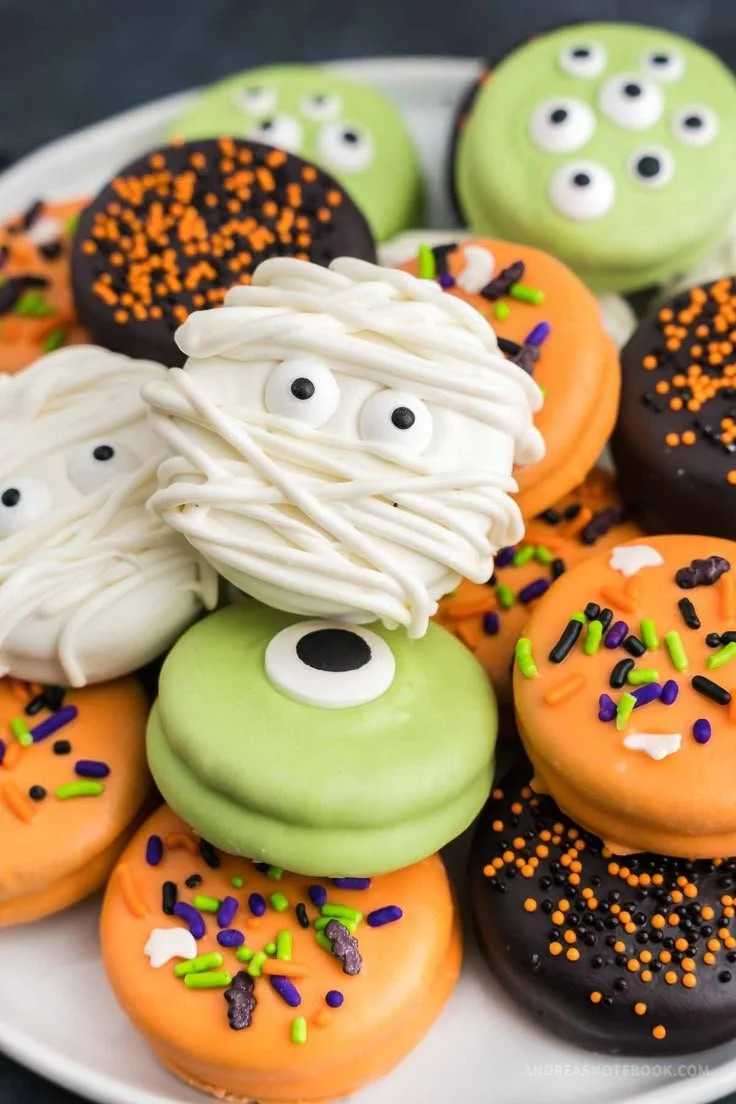 A variety of silly Halloween treats including spooky cookies and monster cupcakes.