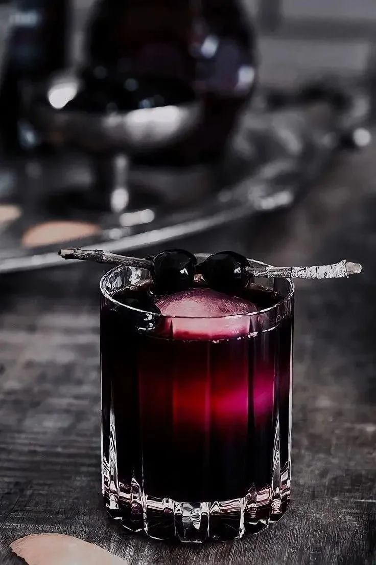 A collection of spooky cocktails for Halloween, featuring eerie decorations and vibrant colors.