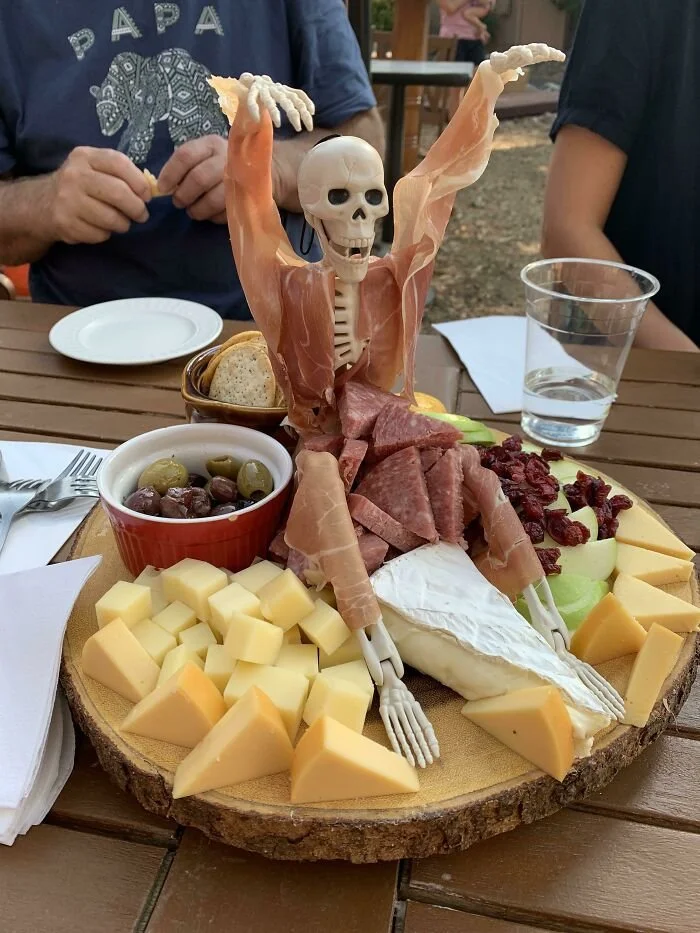 A variety of spooky Halloween-themed foods arranged for a festive celebration.