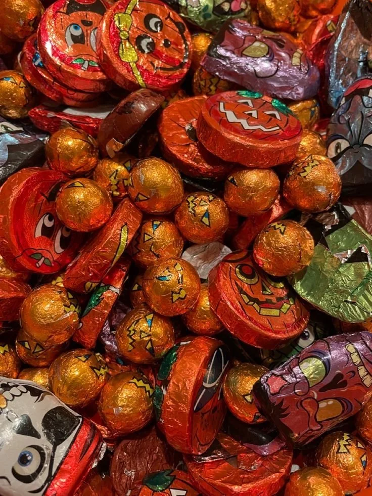 Assorted Halloween candy collection featuring vibrant 2000s and traditional designs