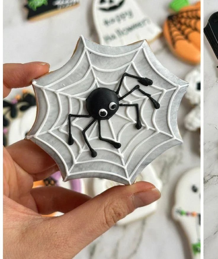 Halloween spider cookie with intricate icing spiderweb decoration