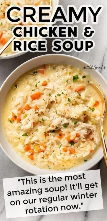 Bowl of creamy chicken and rice soup garnished with herbs
