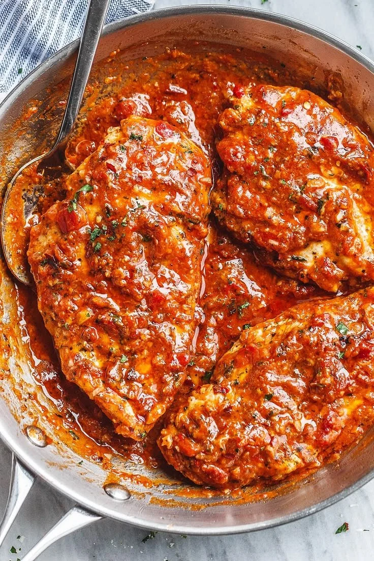 Pan-Seared Chicken Breasts with Pepper Parmesan Sauce plated beautifully.