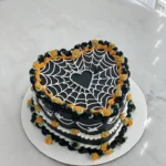 pretty halloween cake with spider webs and orange 2026 08 06 183432 1