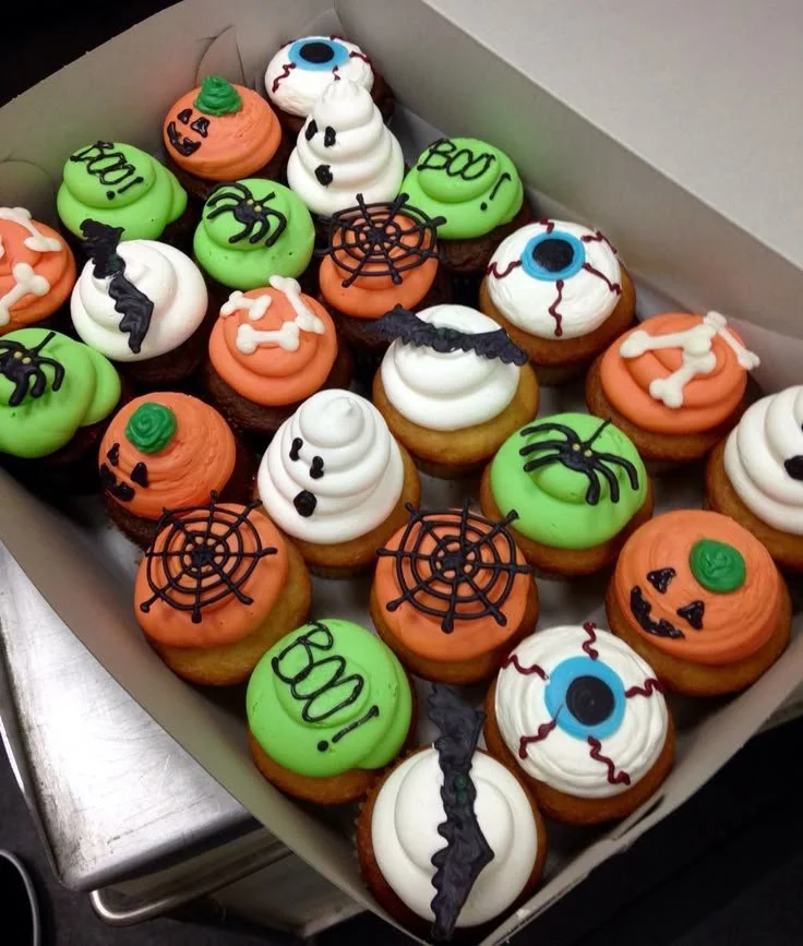 Delicious spooky Halloween cupcakes with festive designs and decorations
