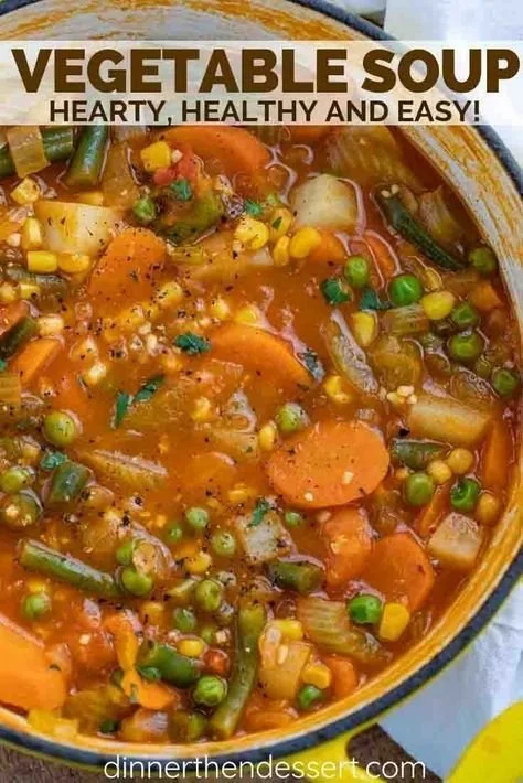 Bowl of homemade vegetable soup with colorful veggies and seasoning