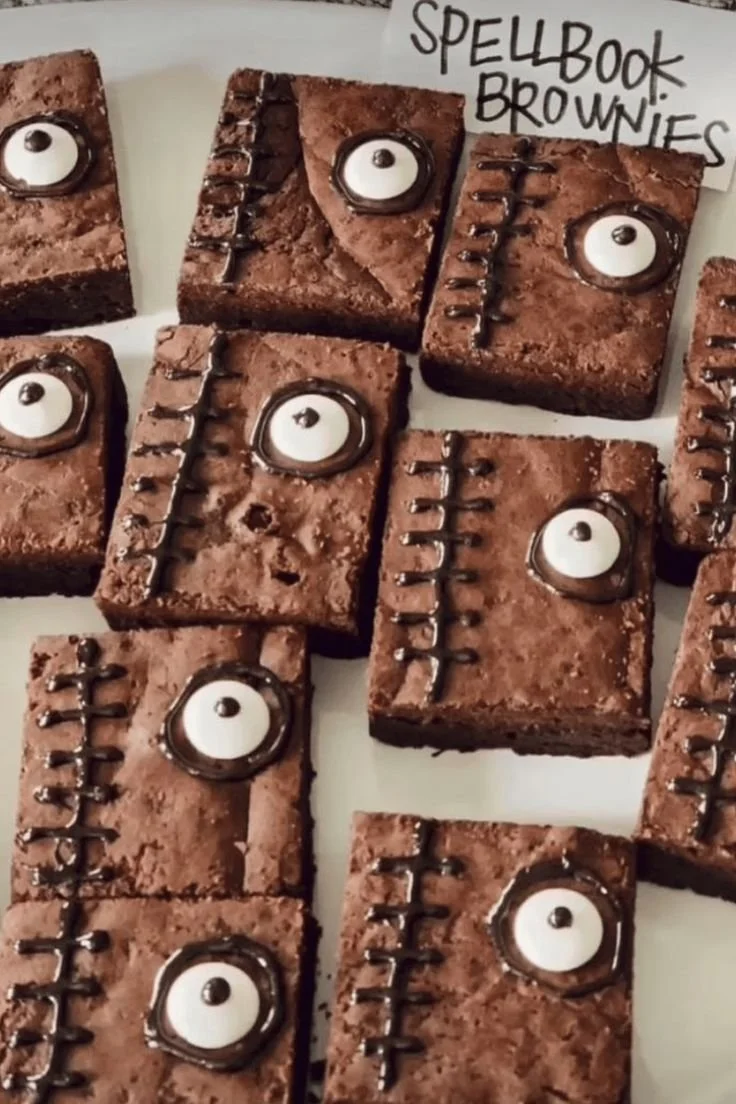 Delicious fudgy spellbook brownies topped with chocolate and sprinkles