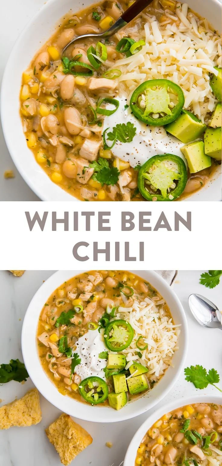 Bowl of white bean chili with chicken and garnishes, a winter comfort food.